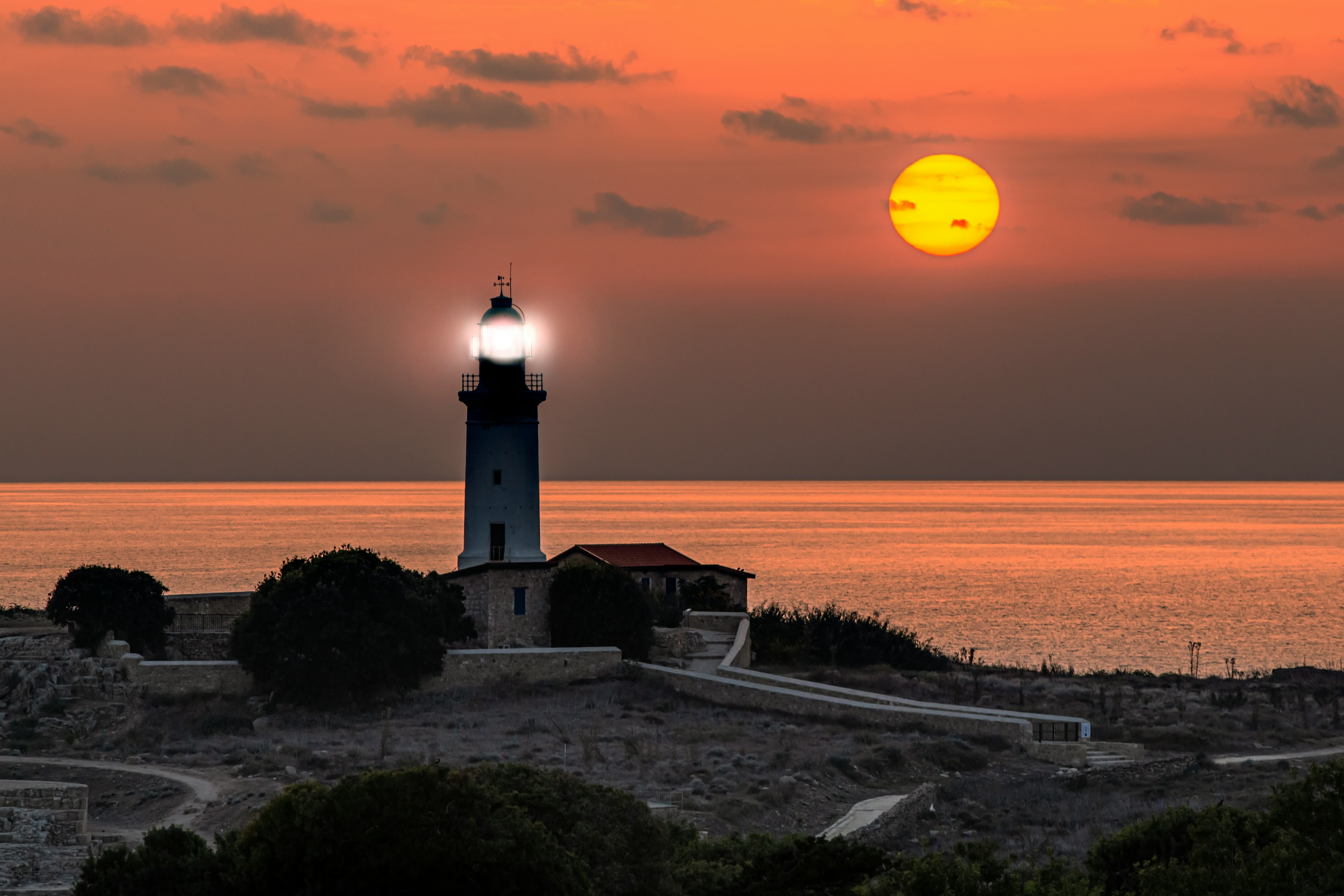 Paphos lighthouse at sunset overlooking the Mediterranean Sea